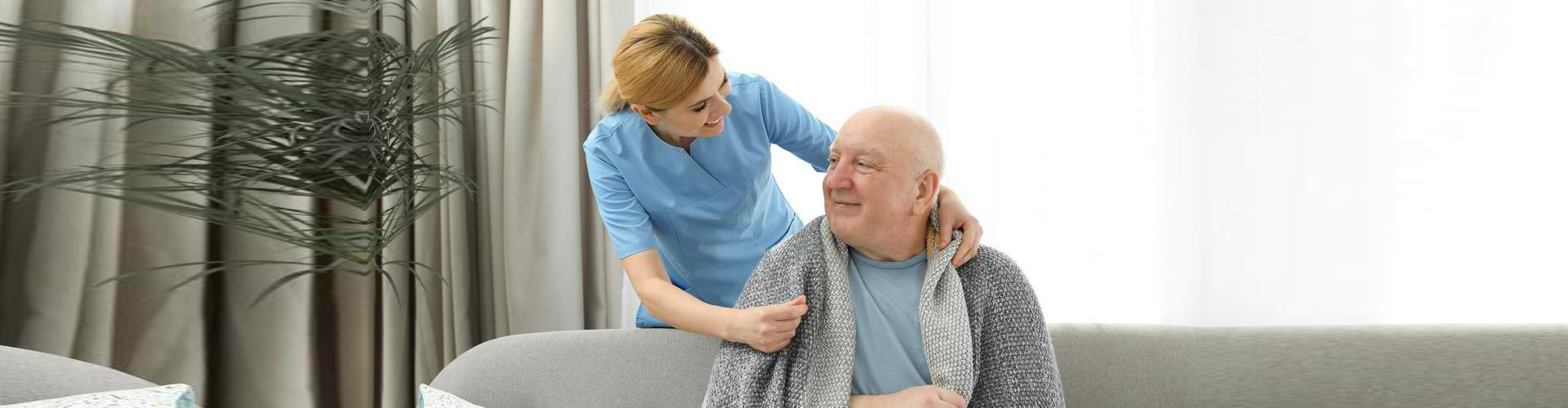 a caregiver woman with an elderly man